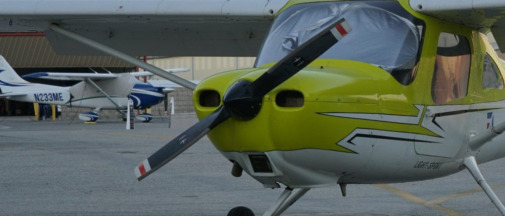 Cessna 162 Skycatcher trainer seen nose first on the Van Nuys ramp at sunset