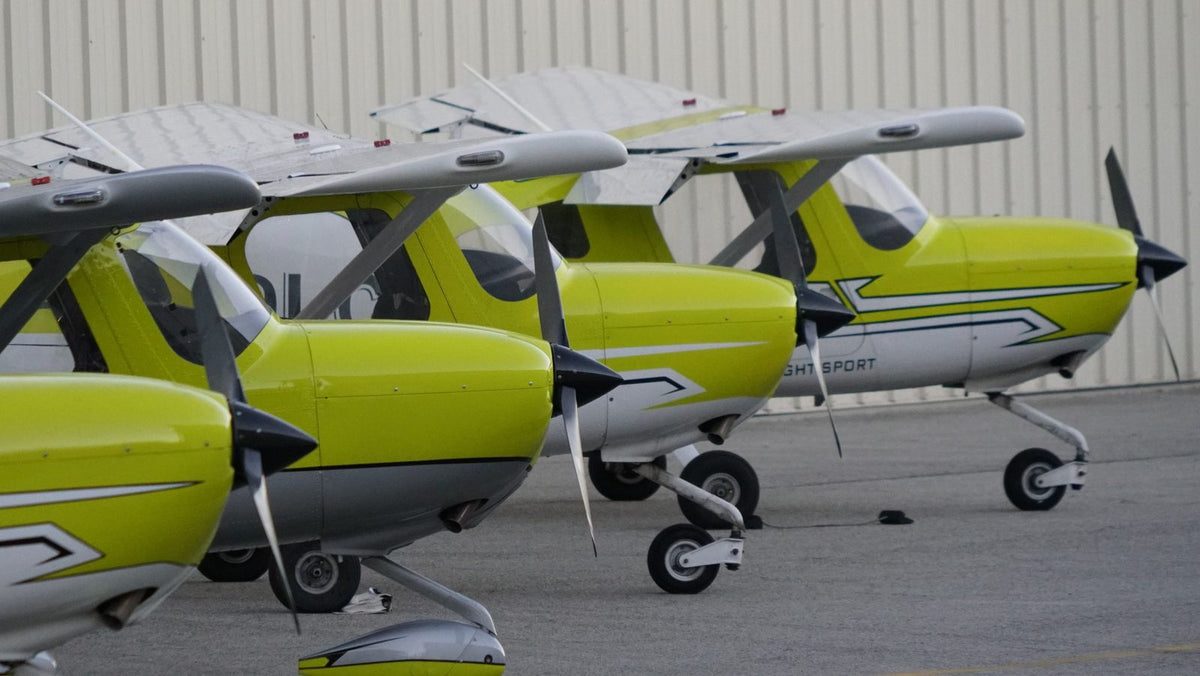 Four Cessna 162 noses and propellers lined up