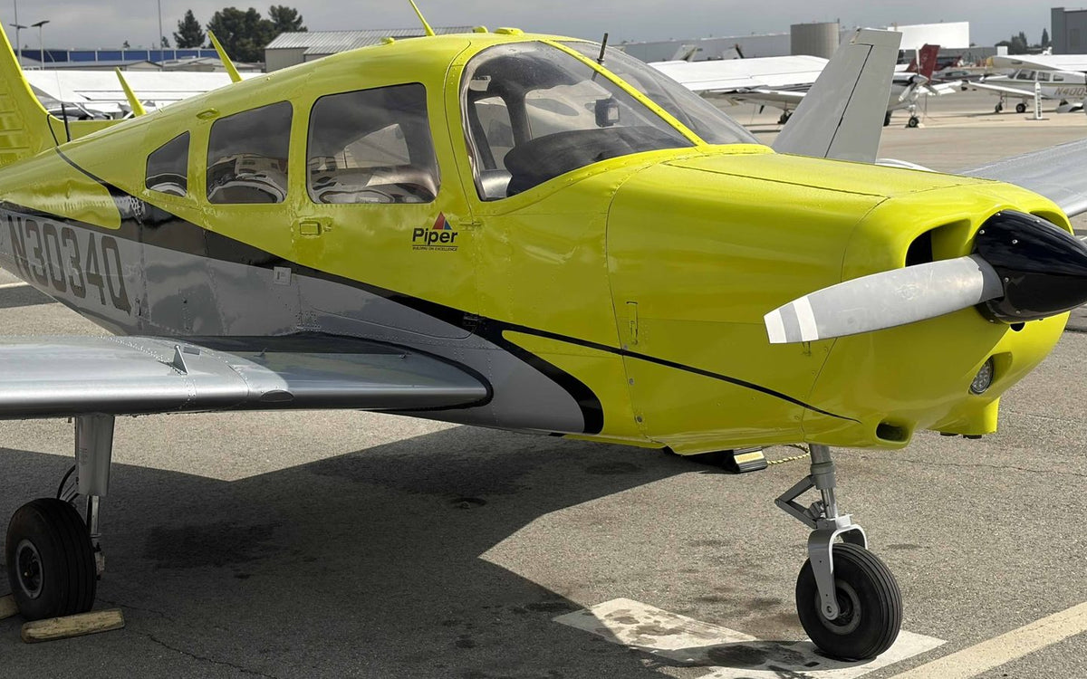 Piper Warrior N3034Q nose and cabin, close front quarter view on the ramp