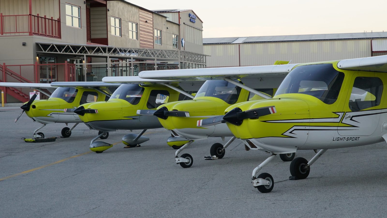 A row of Cessna 162 Skycatchers lined up at Van Nuys Airport