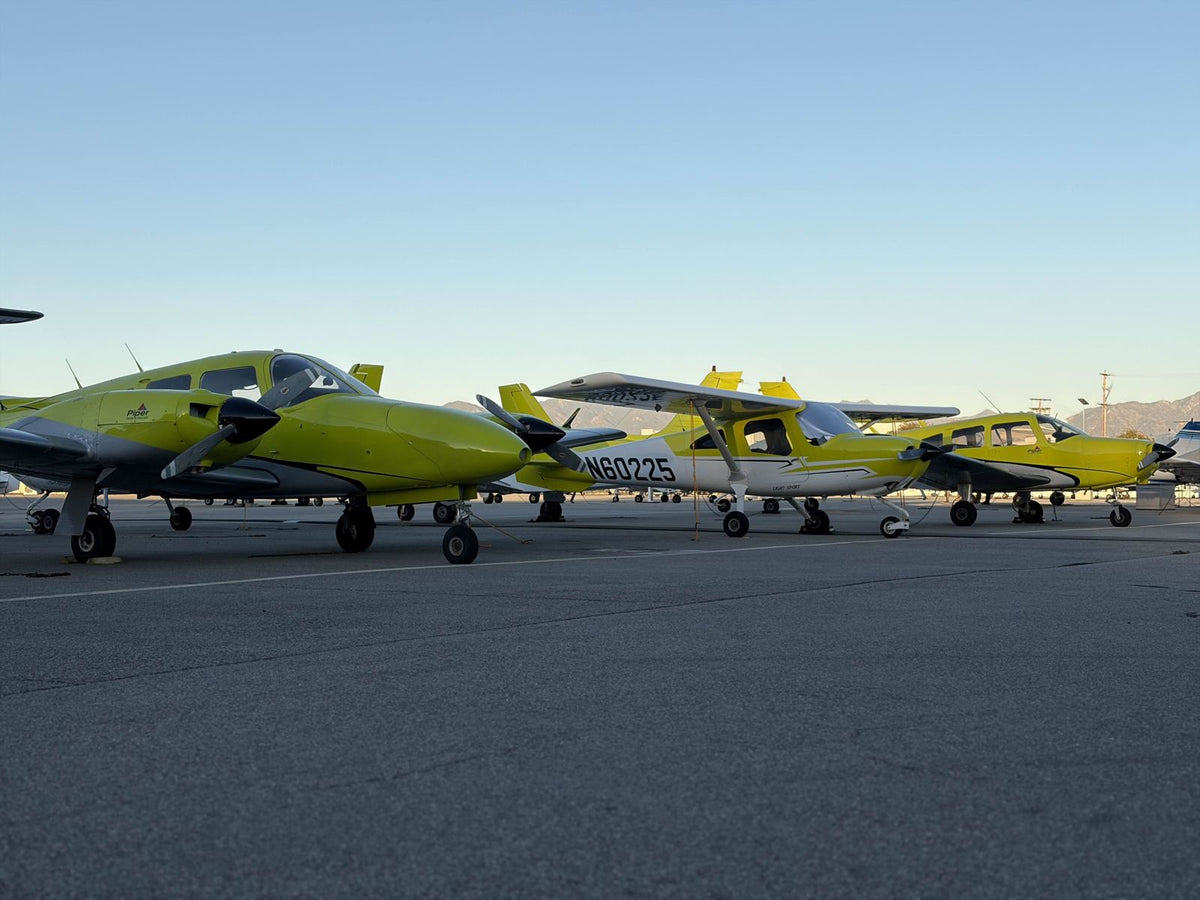 The training fleet lined up on the ramp at Van Nuys Airport at dusk