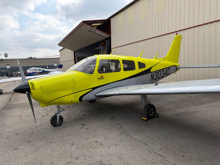 Piper Warrior N3034Q parked by the hangar at Van Nuys Airport before a flight