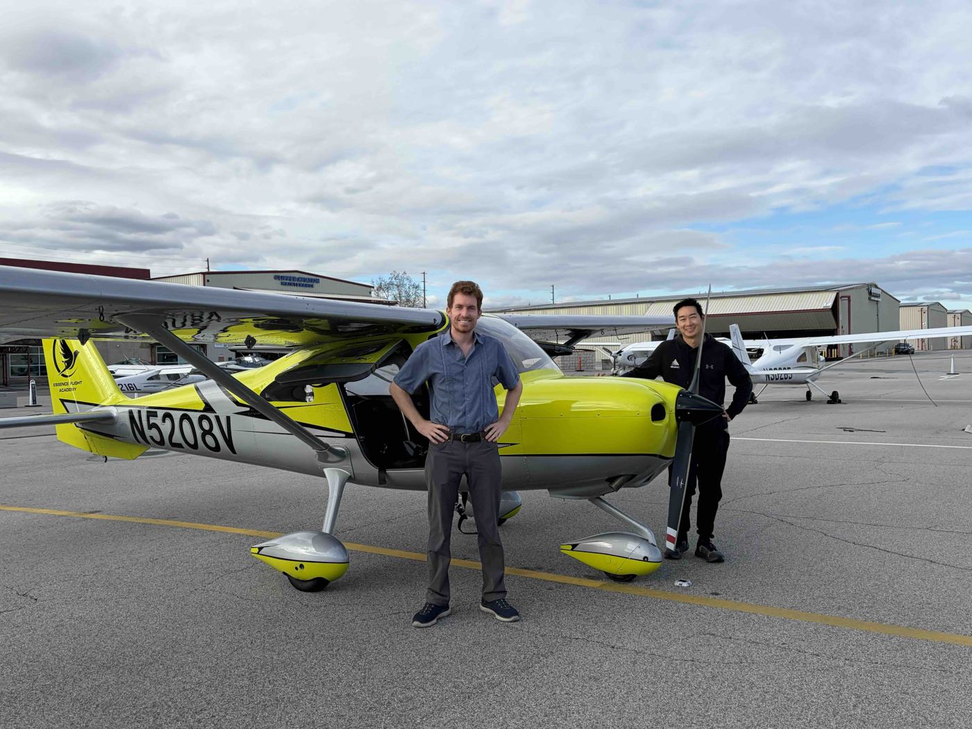 Flight instructors and student pilots standing together on the ramp at Van Nuys Airport